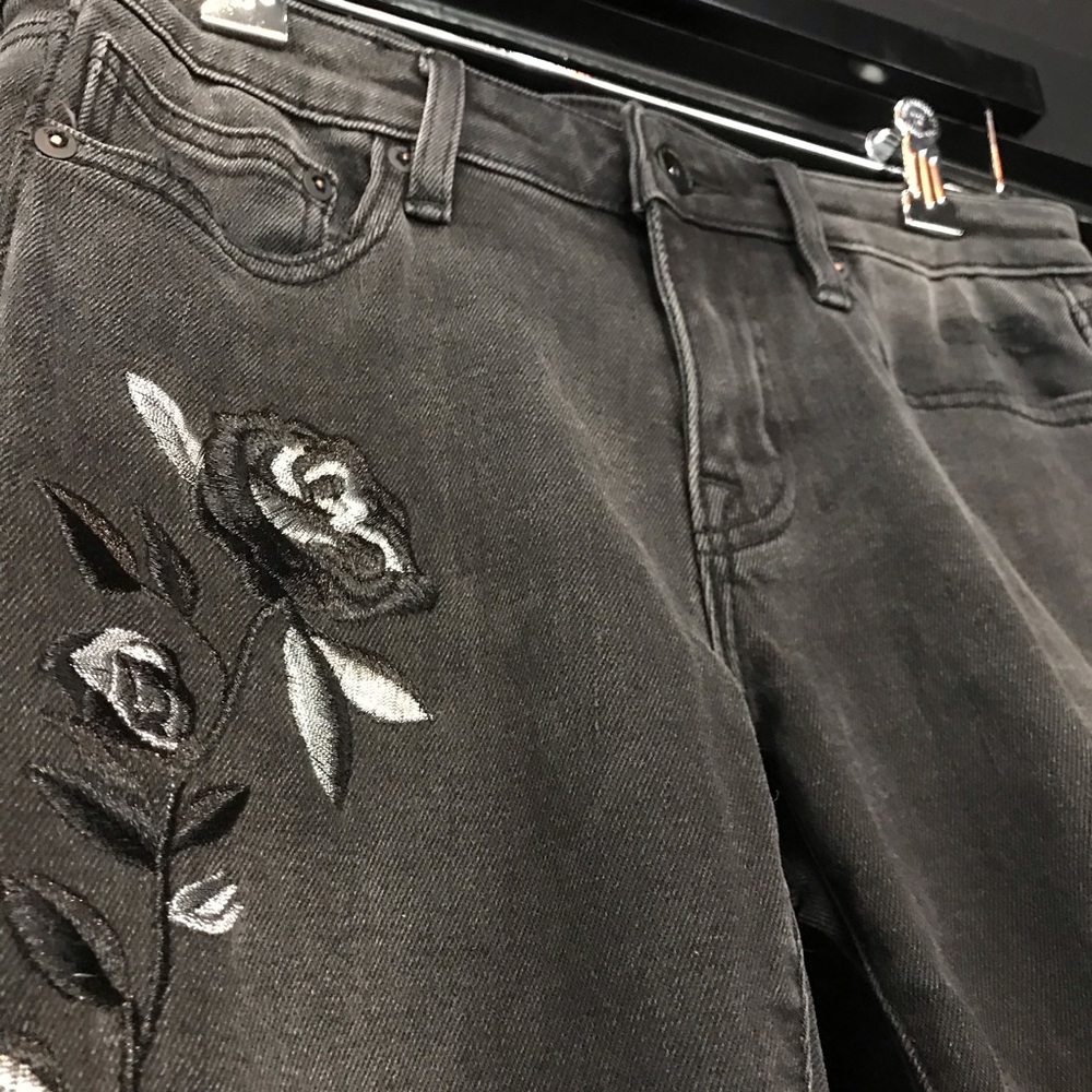 Black jeans w/ flower patch